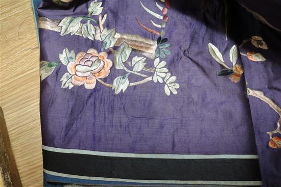A Chinese silk embroidered panel, worked with figures, dragons and peonies, on a purple ground